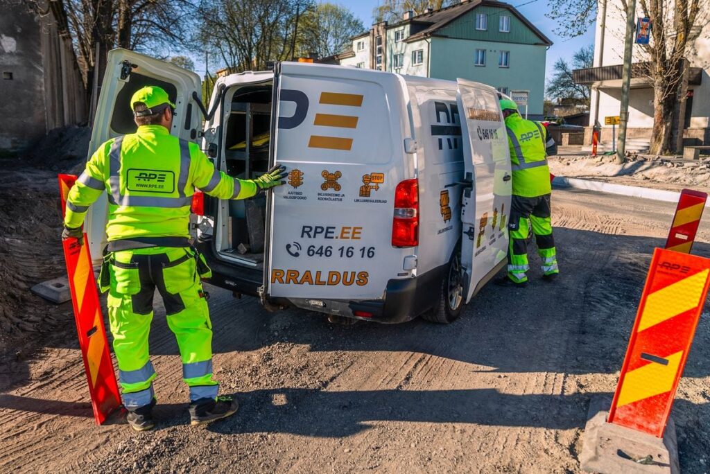 RPE staff next to a van