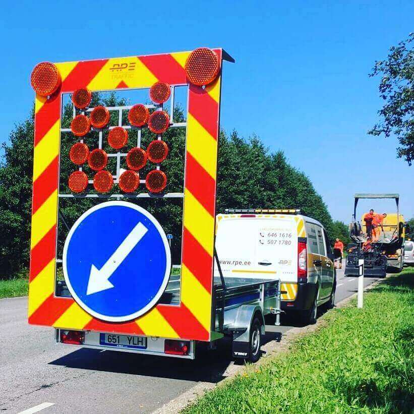 A trailer-mounted warning barrier